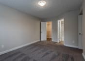 Thumbnail 15 of 19 - Bedroom with window and wooden floor with ceiling light at Bayside Apartment Homes, Hilliard, 43026