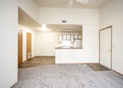 Thumbnail 1 of 23 - A room with a white counter and a fan on the ceiling.