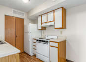 Thumbnail 8 of 30 - Kitchen of a River Valley apartment home in Lancaster, OH, with cabinets, stove, oven, refrigerator.