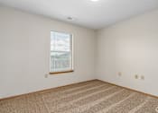Thumbnail 19 of 30 - Carpeted bedroom and window with blinds of River Valley apartment home in Lancaster, OH.