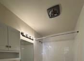 Thumbnail 5 of 12 - A white bathroom with a toilet, sink, and bathtub.