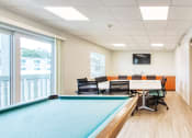 Thumbnail 10 of 13 - conference table and chairs with TV and pool table