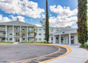 Thumbnail 2 of 13 - Circular drive to entrance of Campus Towers Senior Apartments in Jacksonville