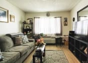 Thumbnail 5 of 13 - living room with wood-style flooring, large window, and decor