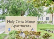 Thumbnail 1 of 12 - Monument sign at entrance to Holy Cross Manor I in Palmetto, FL