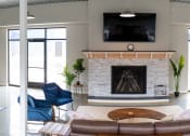 Thumbnail 25 of 166 - a living room with a fireplace and a pool table at Scott's View, Richmond, VA 23230