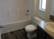 Thumbnail 7 of 13 - this is a photo of the bathroom in a 1 bedroom apartment at deer hill apartments in c