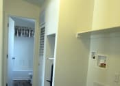 Thumbnail 9 of 13 - a bedroom with hardwood floors and white walls