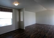 Thumbnail 10 of 13 - an empty living room with a large window