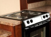 Thumbnail 15 of 18 - a stove top oven sitting inside of a kitchen
