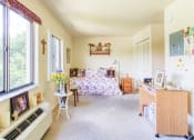Thumbnail 21 of 22 - bedroom or sitting room with large windows, closet, and model decor