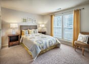 Thumbnail 14 of 25 - Comfortable Bedroom With Large Window at The Apartments at Wellington Trace, Frederick