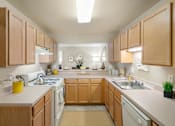 Thumbnail 13 of 25 - Fully Equipped Kitchen With Modern Appliances at The Apartments at Wellington Trace, Frederick, 21703