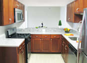 Thumbnail 12 of 25 - Electric Range In Kitchen at The Apartments at Wellington Trace, Maryland, 21703