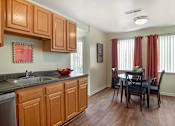 Thumbnail 11 of 28 - Artistic Finished Dining and kitchen Room at The Apartments at Elmwood Terrace, Maryland