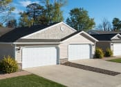 Thumbnail 2 of 9 - Lake Orion MI Apartment Rentals Redwood Waterstone At Village Square Two Car Garage