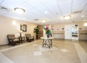 Thumbnail 9 of 12 - lobby with tile flooring, seating, and mailboxes