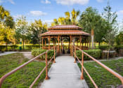 Thumbnail 10 of 12 - walkway with railings to gazebo in courtyard