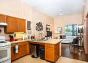 Thumbnail 2 of 12 - kitchen with white appliances and wood cabientry