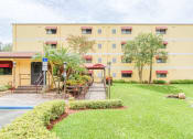 Thumbnail 2 of 24 - Neat landscaping and well-kept exterior at Casa San Pablo Senior Apartments