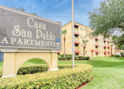 Thumbnail 1 of 24 - Monument sign with community name "Casa San Pablo Apartments" in front of building