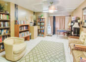 Thumbnail 10 of 24 - large library with comfortable chairs and plenty of books to read at Casa San Pablo