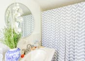 Thumbnail 17 of 24 - bathroom with decor and striped shower curtain