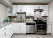 Thumbnail 1 of 35 - Chef-Inspired Kitchens Feature Stainless Steel Appliances at Element at Kirkwood, Atlanta