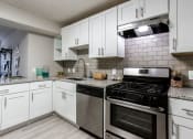 Thumbnail 2 of 35 - Modern Kitchen With Custom Cabinet at Element at Kirkwood, Georgia