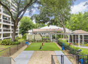 Thumbnail 27 of 30 - spacious fenced dog park at pet-friendly Sundale Manor Senior Apartments