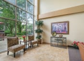 Thumbnail 2 of 30 - massive windows in lobby seating area of Sundale Manor Senior Apartments in Jacksonville, FL