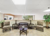 Thumbnail 19 of 30 - sitting area with comfortable love seat, chairs, and coffee table