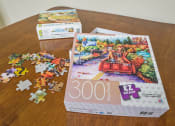 Thumbnail 21 of 30 - puzzles sitting on a table for residents to enjoy at Sundale Manor Senior Apartments