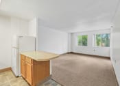 Thumbnail 15 of 30 - open kitchen and living room with large windows at Sundale Manor Apartments1`
