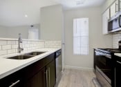 Thumbnail 9 of 20 - Kitchen with stove,