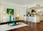 Thumbnail 3 of 19 - Furnished living room and seating at breakfast bar