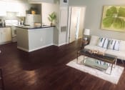 Thumbnail 8 of 19 - Furnished living room and kitchen