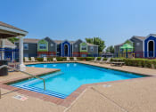 Thumbnail 5 of 9 - Pool surrounded by lounge chairs