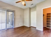 Thumbnail 18 of 25 - Living room with patio door and ceiling fan