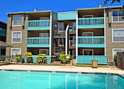 Thumbnail 11 of 13 - Pool with building behind it