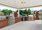 Thumbnail 12 of 30 - Grill Area near apartment pool