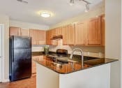 Thumbnail 22 of 30 - Fully-Equipped Apartment Kitchen