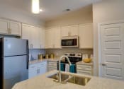 Thumbnail 20 of 29 - Fully Equipped Kitchen Includes Frost-Free Refrigerator, Electric Range, & Dishwasher at Evolve at Tega Cay, Fort Mill, SC, 29708