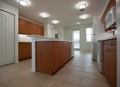 Thumbnail 15 of 30 - spacious kitchen with island and lots of cabinets