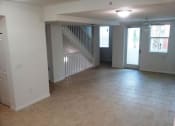Thumbnail 18 of 30 - large living room with tile flooring