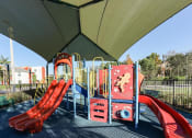 Thumbnail 29 of 30 - covered playground at East Village Apartments in Davie, FL