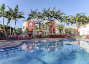 Thumbnail 3 of 30 - lush landscaping around East Village Apartments pool