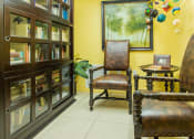 Thumbnail 15 of 24 - fully-stocked library with seating