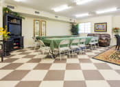 Thumbnail 23 of 24 - community room with dining tables