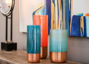 Thumbnail 12 of 26 - a table with three vases on it and a painting in the background